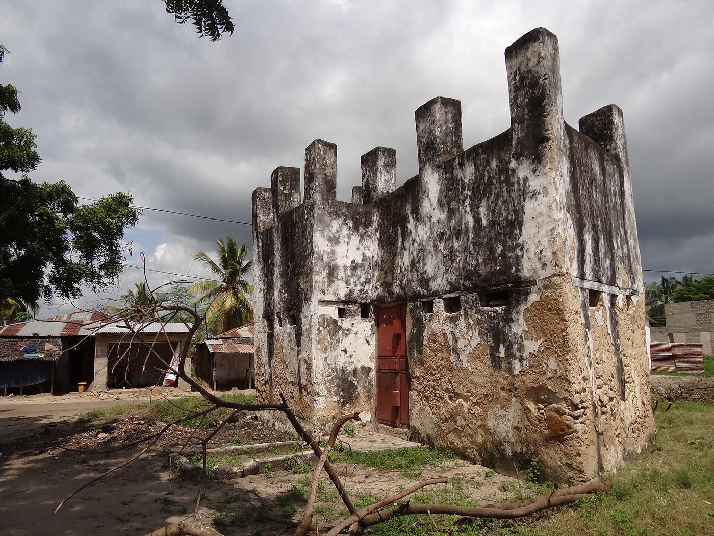 A small crenellated 19th-century block house of dark coral stone in Bagamoyo