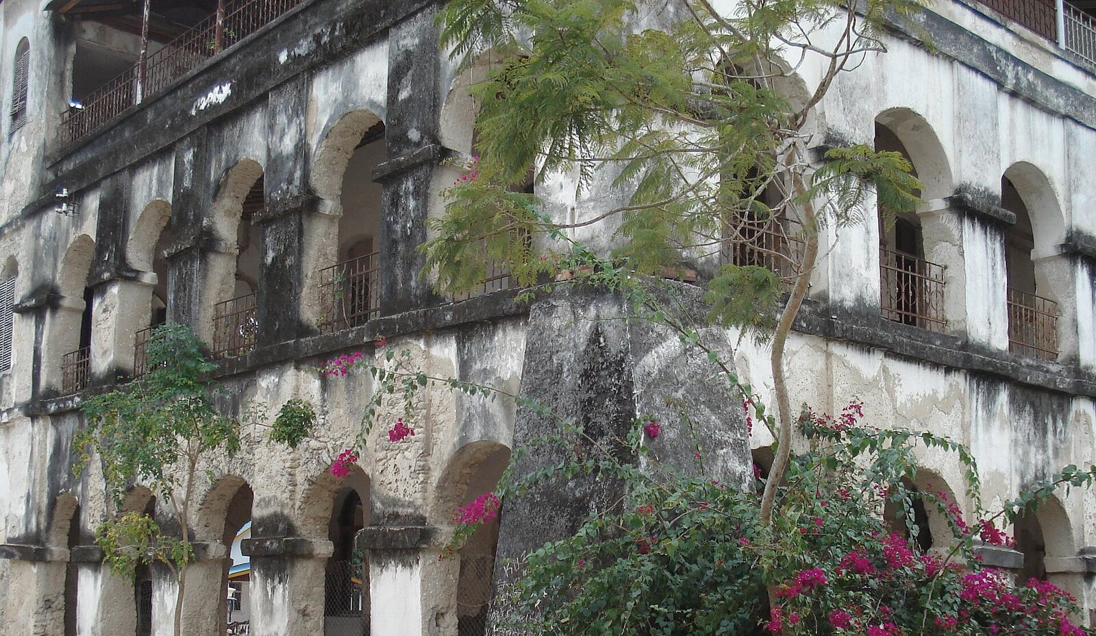 The arcaded mission building at Bagamoyo with bougainvillea